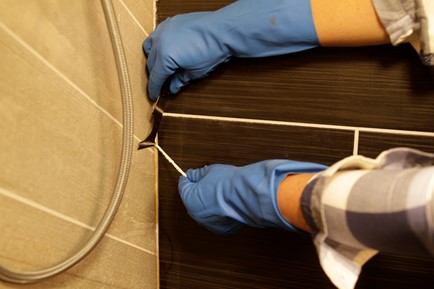 scrape off softened caulk